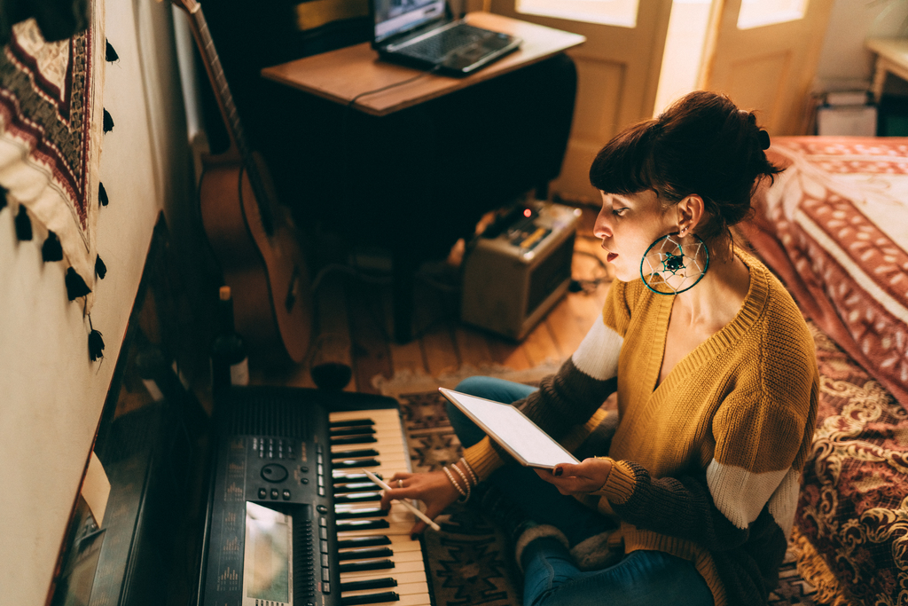 woman practicing piano 