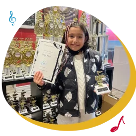 girl with certificate and music trophy in toronto