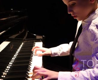 piano lesson student boy playing piano with both hands in shirt and tie_opt (1)