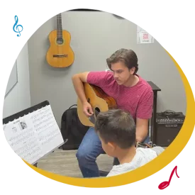 toronto guitar lesson teacher with boy music student